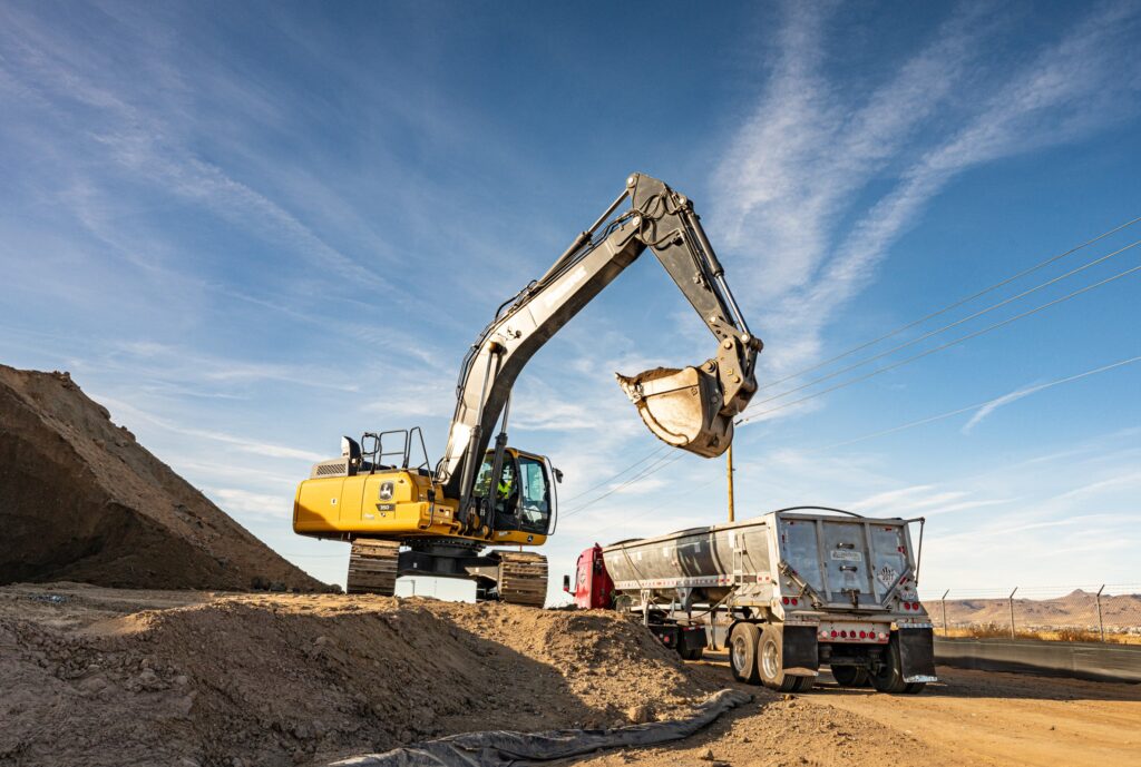 Backhoe removing hazardous waste