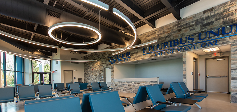 lobby space with chairs and lighting, designed by a certified interior designer